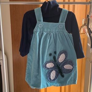 Adorable jumper with turtle neck.